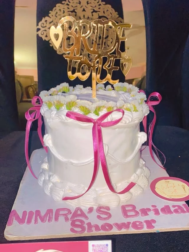 Beautiful bridal shower celebration cake with 'BIRTHDAY TO BE' and 'NIMRA'S Shower' decorations - Bridal Party Cakes Karachi By Whisk And Sift